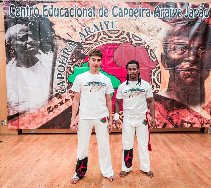 A picture of the organisation members Mestre Neguinho and Mestrando Toshio